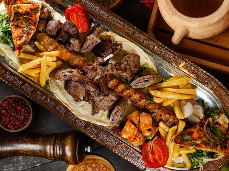 fried-meat-set-with-sliced-onion-pomegranate